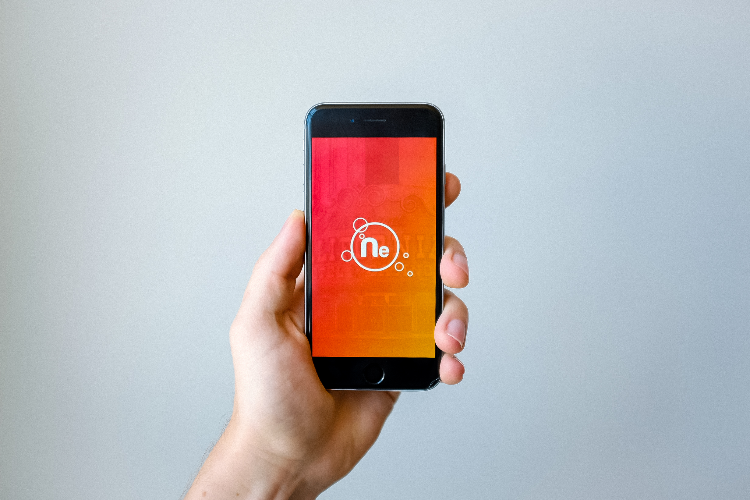 A hand holding a smartphone